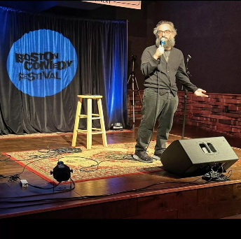 Event branding projected on a stage backdrop